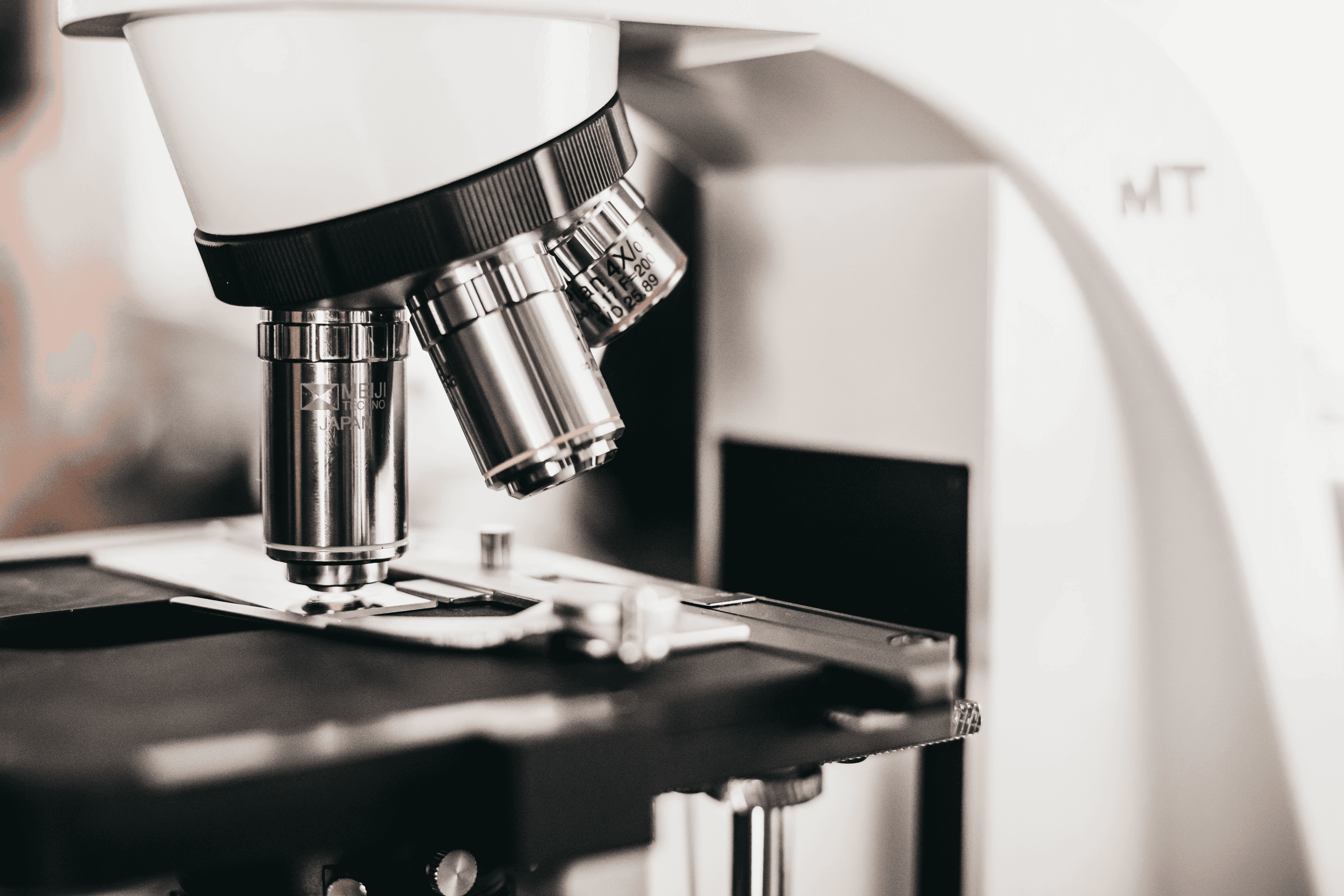 Scientist testing adhesive samples in an R&D laboratory